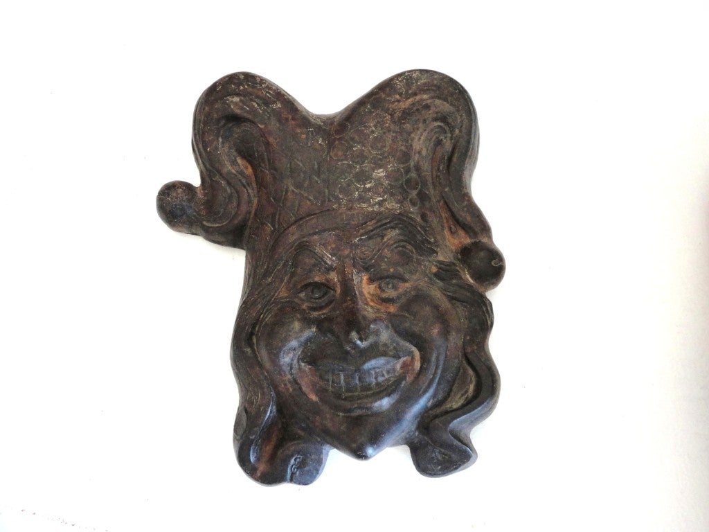 Fantastic 19th century wall hanging folk sculpture of the English court jester, looks like the joker. This folky cast sculpture looks like it was something from the carnival or circus but it was the guy that entertained kings & Queens. It is very