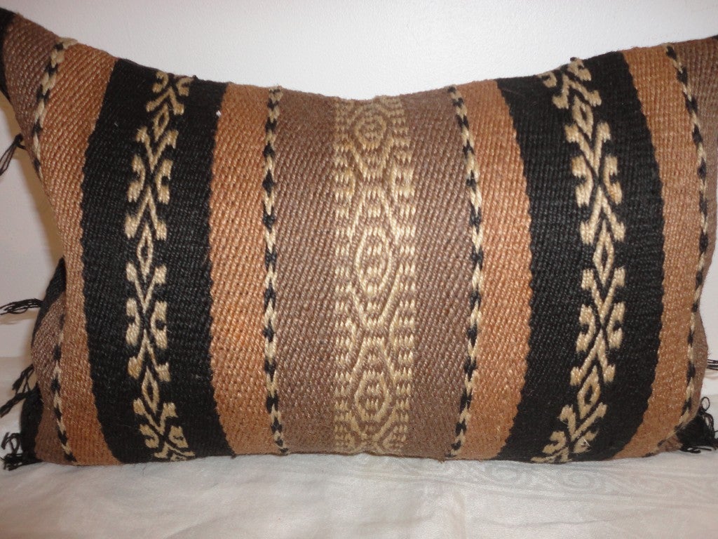 This small kidney  size Indian weaving pillow has such wonderful colors and condition.These colors are hard to find and condition is very good.
