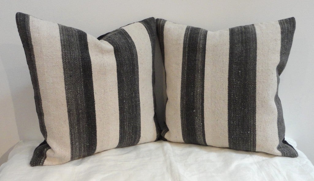 These fantastic saddle blanket weaving pillows are in a charcoal black/grey color with cream stripes.They are sold as a pair.Four in stock.