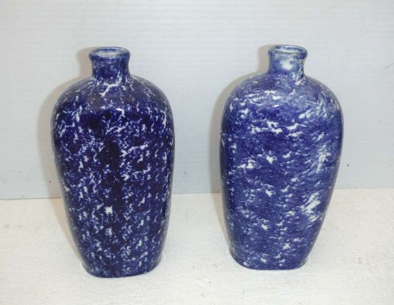 These bottles are most unusual for blue and white sponge ware pottery. They are also both signed made in Belgium. They are in pristine condition. Sold as a pair.