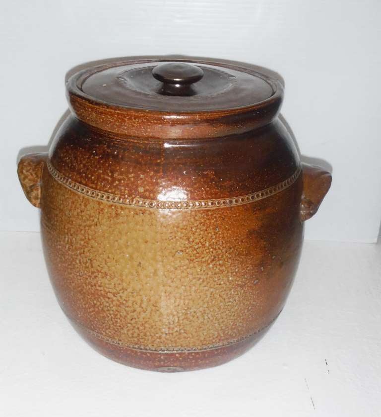 This beautiful salt glazed stoneware double handled pot by Bendigo-Epson, Australia. This pot is stamped and signed on the base. This Bendigo Potters were established in 1858.