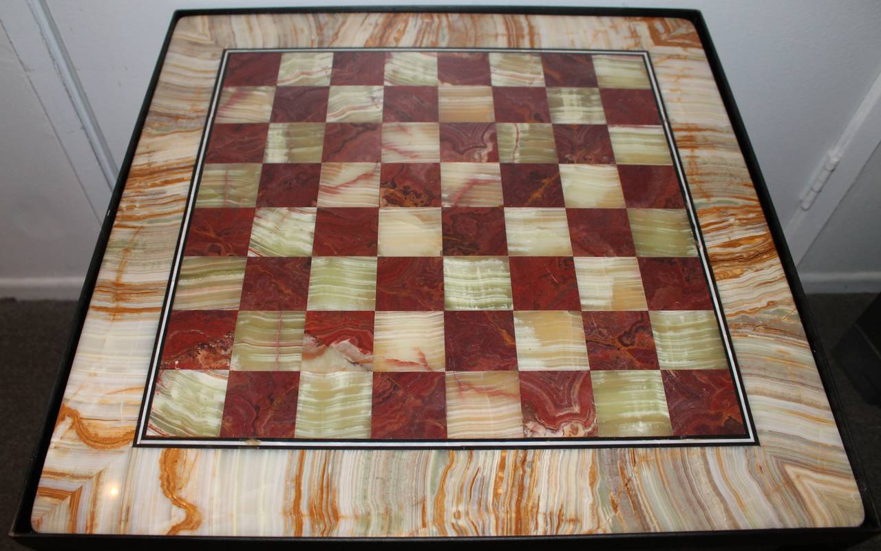 This is quite unusual and in wonderful neutral colors. The large oversize gameboard has a double black inner border. The custom-made iron base is very strong and sturdy. The condition is very good and strong.