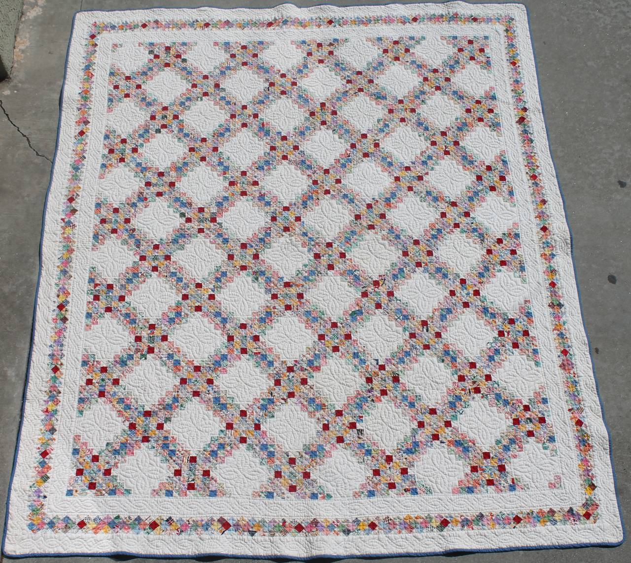 Wow this quilt consists of mini postage pieces and has super tight quilting. The quilt is a large size quilt and would fit a queen or king bed. Such amazing presentation. The scale and condition is the very best.