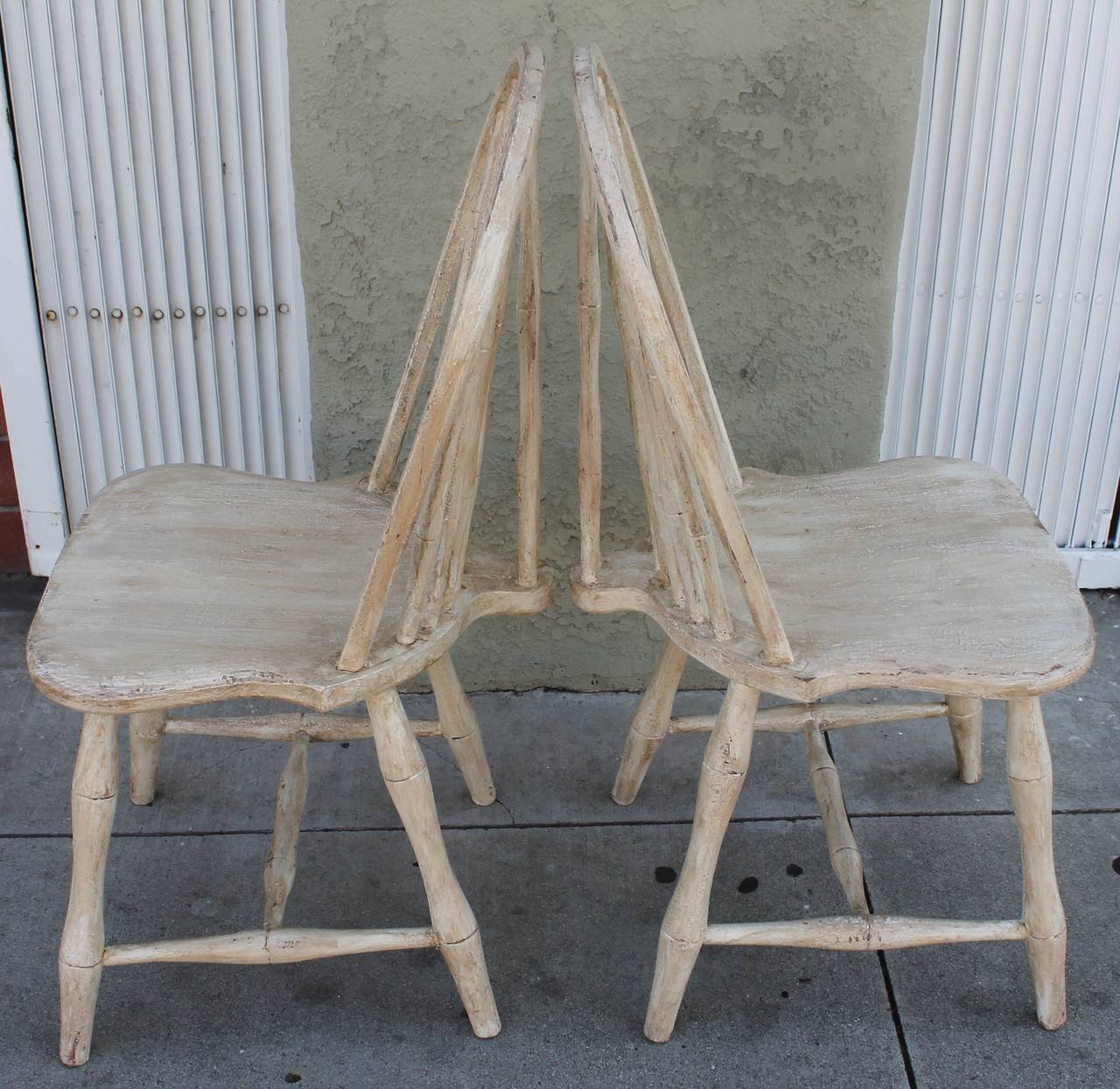 This pair of very sturdy 19th century antique eggshell over painted surface have such a great look. This color goes with so many different country looks or styles. These chairs have a base coat of old red. Sold as a perfect matched pair.