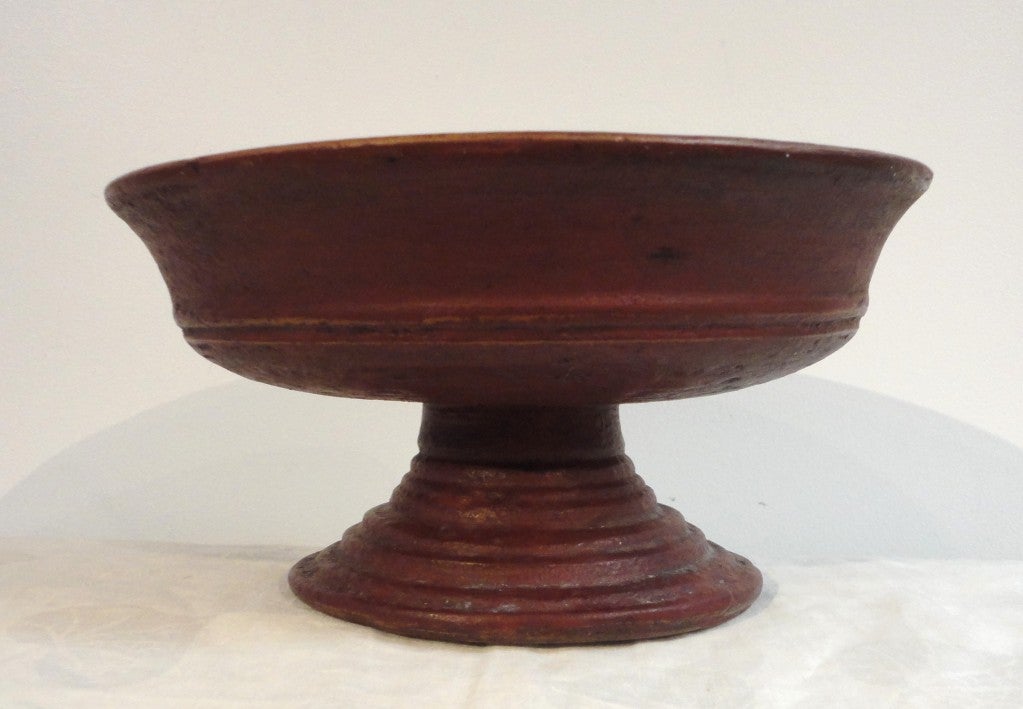 Fantastic & Rare original red painted treen compote made from one piece of wood. This New England compote was made for fruit but also great for velvet or stone fruit in today's world.This very rare & early large & heavy pedestal is in great