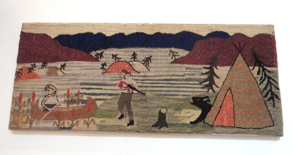 Fun and folky pictorial Indians at camp. This wonderful hand hooked rug tells a story with out words. The condition is good and is sewn on linen and stretched,ready to hang on the wall. It is really folk art at it's best.