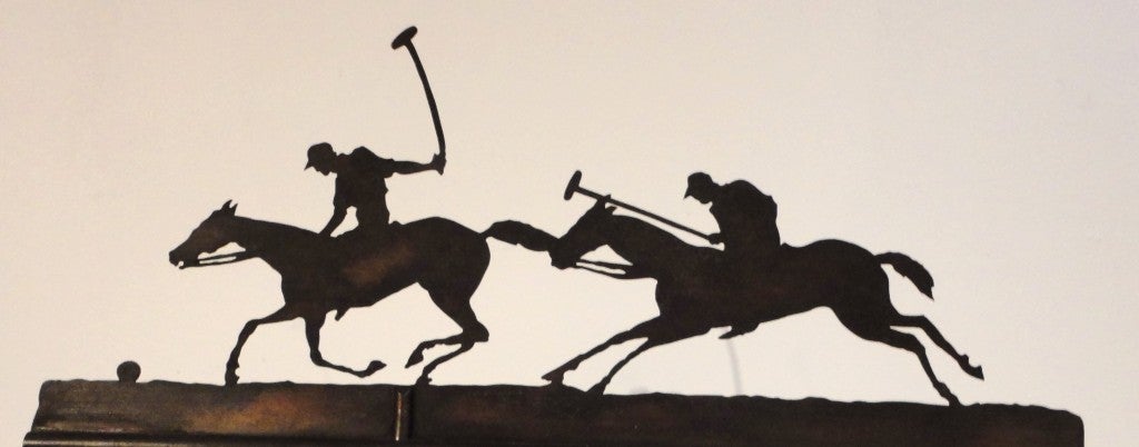 Fantastic early 20thc sheet copper weather vane of the polo players in original old surface. This wonderful example of folk art is made by The Harold Jones Company of New York City and comes with a custom made cast iron stand. This is one of the