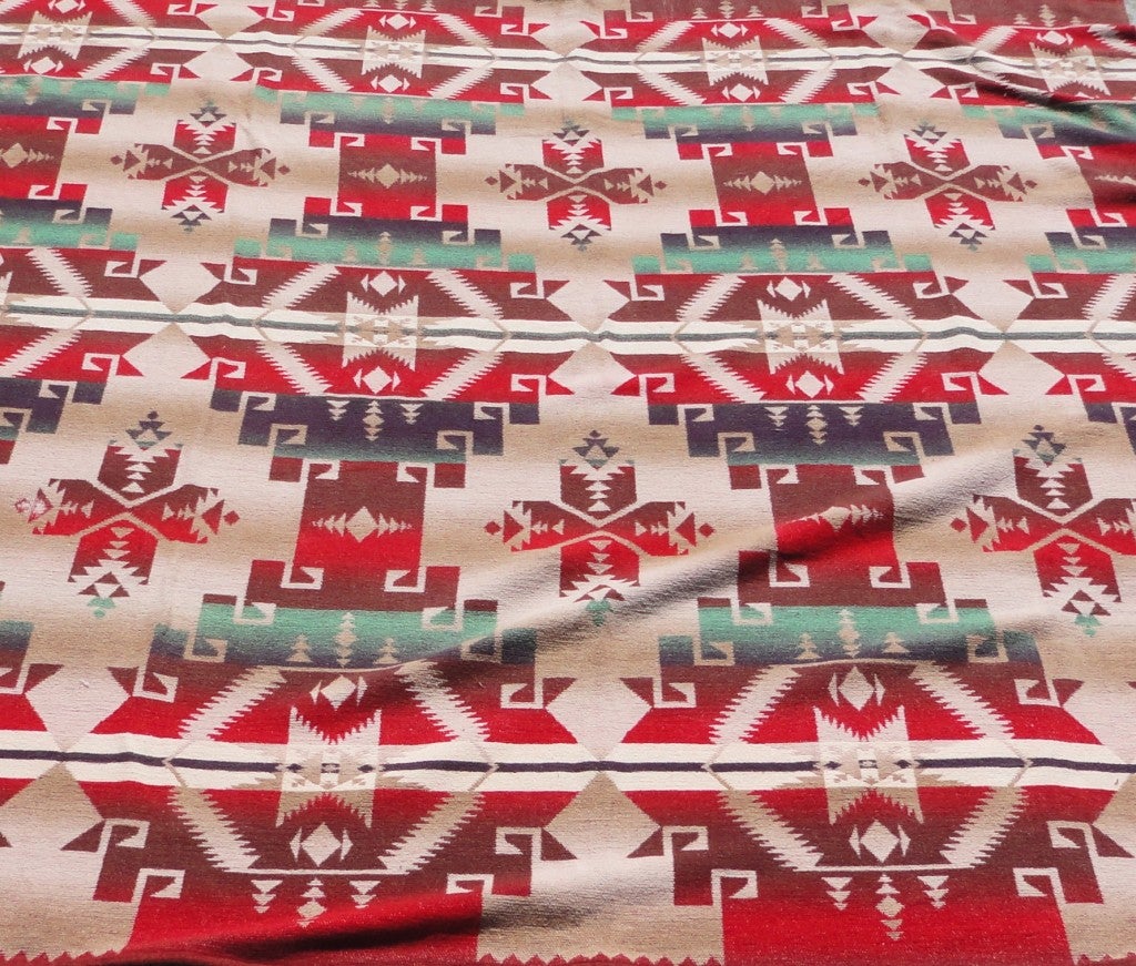 Early cotton Indian design Beacon blanket.This blanket has wonderful geometric design pattern and is pristine condition.This blanket is tan,brown,red,green and cream.