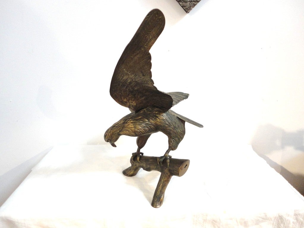 large brass eagle on branch