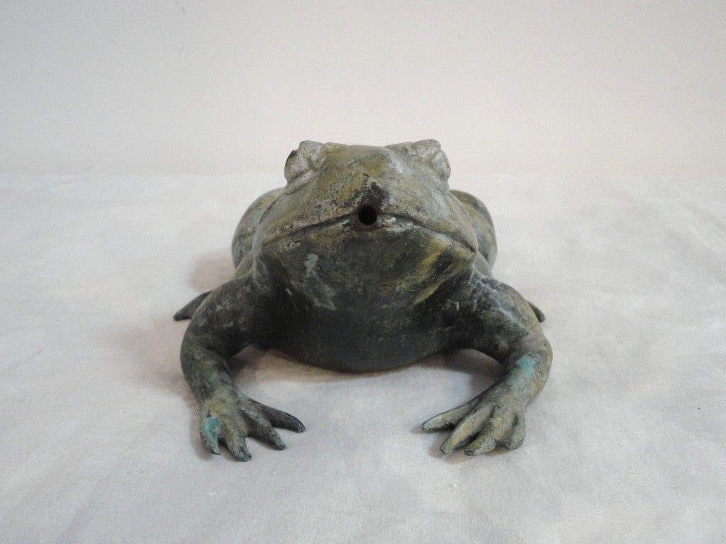 This wonderful bronze frog has such a great patina and worn surface.The form and condition are the best.