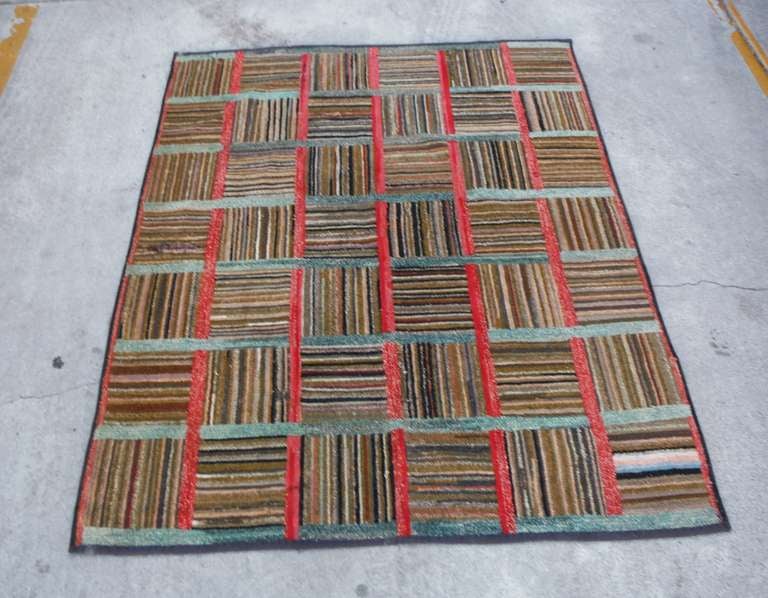 Fantastic  large 19thc   log cabin hand hooked log cabin pattern area rug from the state of Maine .This newly bound and professionally clean hooked rug has amazing cool colors and would go with any decor. The squares reverse and border in