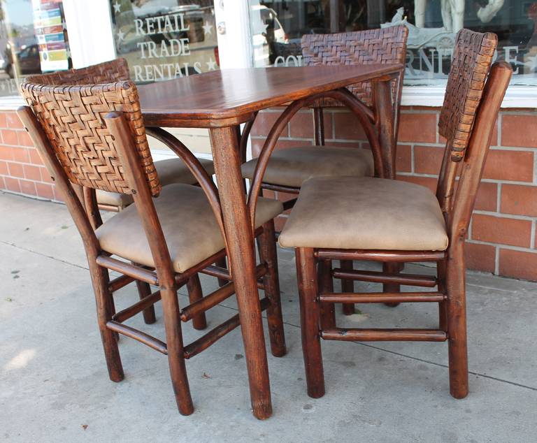 This is such a great set of signed Old Hickory , Martinsville,Indiana both table and four chairs are signed by the maker. The old original crackle surface on the legs of the table is fantastic.The condition is very good and sturdy and the seat