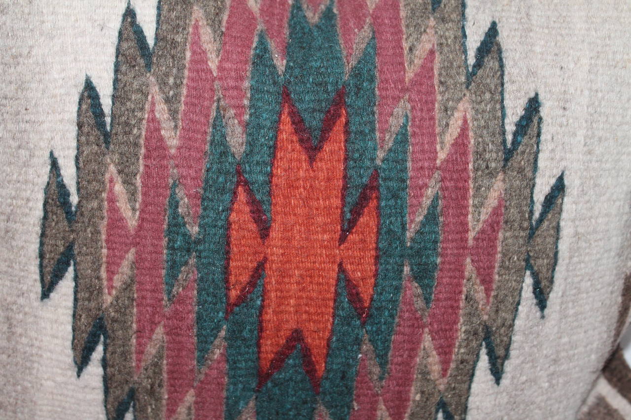 These unusual eye dazzler Navajo Indian weaving's are vibrant and have Greek key borders. The backings are in brown cotton linen. These weaving's are late but great. Condition are very good.