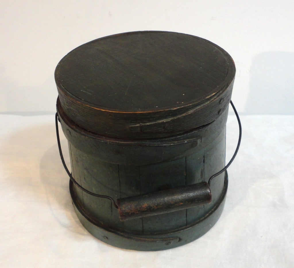 Amazing small scale original painted 19thc sugar bucket from New England.Wonderful form and patina.The condition is very good.