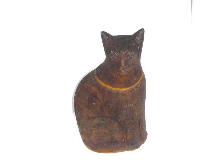 This extremely rare early salt glazed brown cat cookie jar dates to 19th century New England.

This stoneware cookie jar was made in the coil tradition and finished in very detailed hand work with a brown salt glaze.  The interior of this piece is
