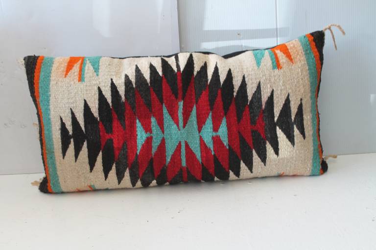 This Indian sunset looking Navajo weaving was founding  a Palm Springs collection . The colors are fantastic and condition is also very good ! The insert is down & feather fill and the backing is in  a  black  cotton linen .