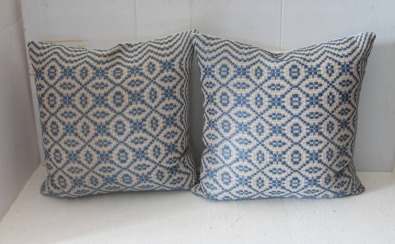 19th century Jacquard coverlet woven pillows with white linen backing. The insert is down and feather fill. Two pairs in stock. Sold as a pair.