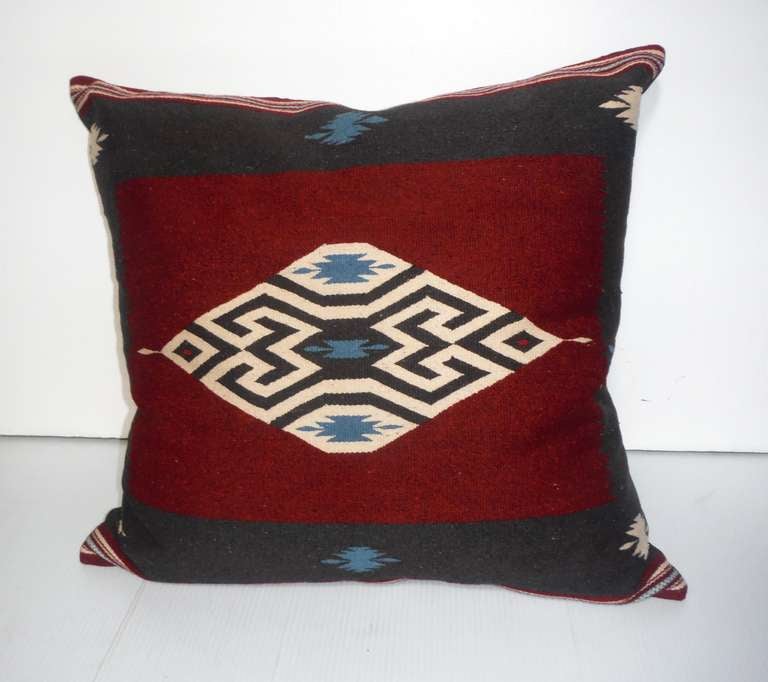 Vibrant and geometric early Texcoco Indian weaving pillow with a black cotton linen backing. These colors are amazing! The insert is down and feather fill with a zipper closure.