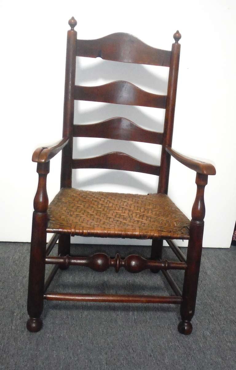 This is a very rare mid to late 18th C Delaware River Valley ladder back side chair.  These chairs were first discovered along the Delaware River in Pennsylvania, New Jersey, Delaware, and Maryland. This chair shows all of the characteristics