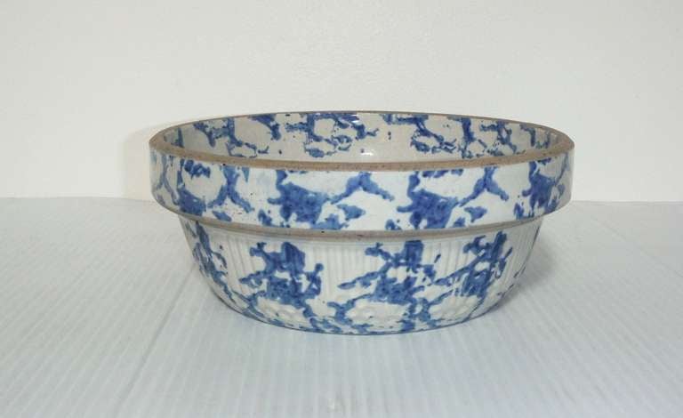 This heavy sponge ware pottery bowl has the sponge design on both the inside rim and outside of the bowl. This type of crockery bowl was used for baking .Today they are great used for fruit on a table. Condition is mint. Minor wear on base from age