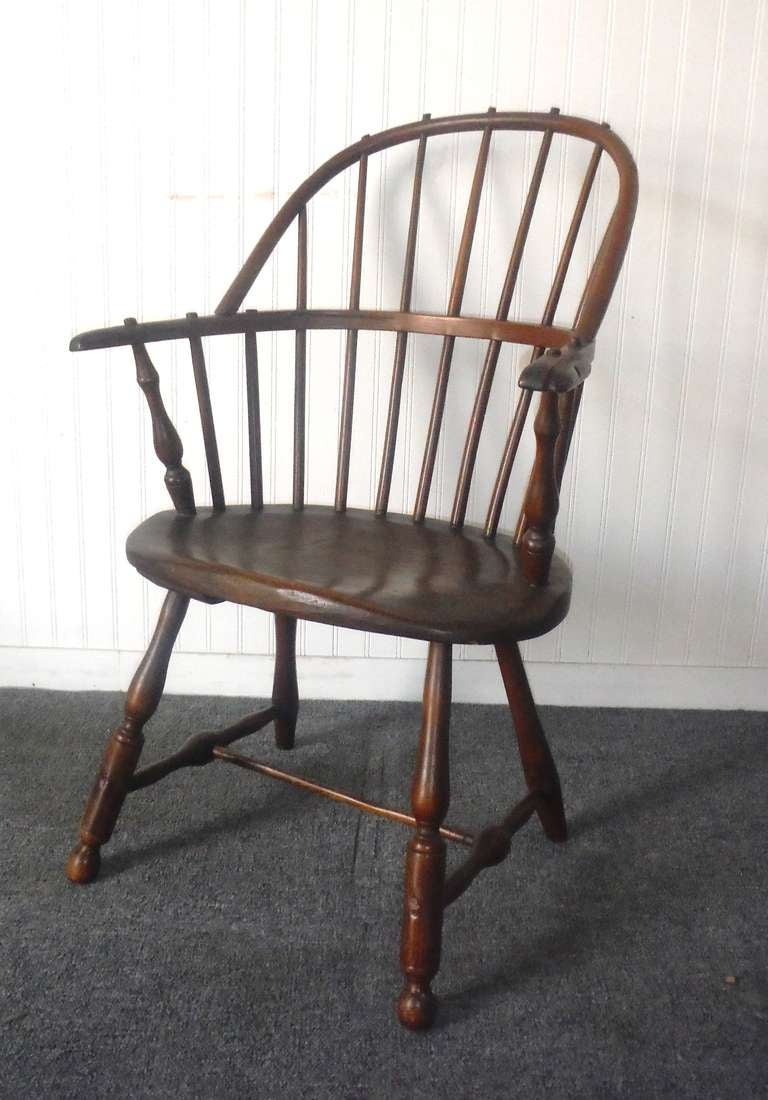 Late 18th c. New England sackback extended arm Windsor chair with  particularly good proportions and turnings. The seven back spindles fan almost perfectly to fill the bow and balance smoothly with the weight of the turnings.  A beautiful and