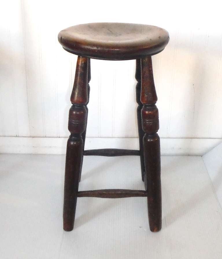 This sturdy early 19th c. English pub stool is in excellent and untouched condition.  Very nice patina and original finish.

The stool is signed underneath the seat 