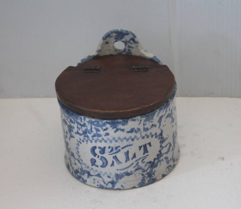 This rare form in a sponge ware salt crock is most unusual with the odd font lettering of salt. The lidded pine hinge top is in great condition as well as the base. This is great addition to any collection.