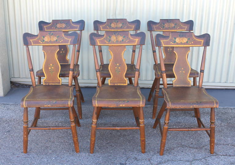 This is a fantastic set of six matching 19th century Lancaster County, Pennsylvania paint decorated chairs. The paint is fantastic with great details to the inside back splash. The condition is very good and sturdy with a wonderful worn patina. Sold