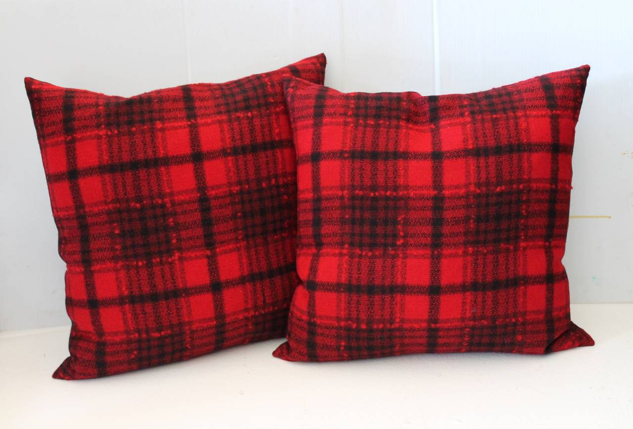Fantastic black and red wool blanket pillows with a black cotton linen backing. The inserts are down and feather fill. Sold in pairs. Two pairs in stock.