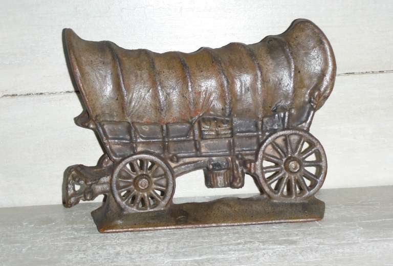 This wonderful and heavy doorstop has a great untouched patina and is in very good condition .