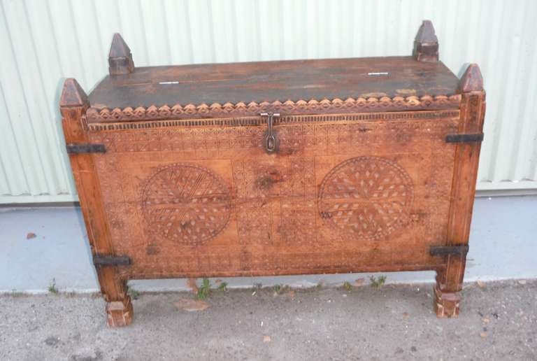 This very early hand-carved and chipped carved wood box or trunk. This amazing hand-carved lift top box has all the original handmade hardware and hinges. The legs are in very good condition along with the wood box.