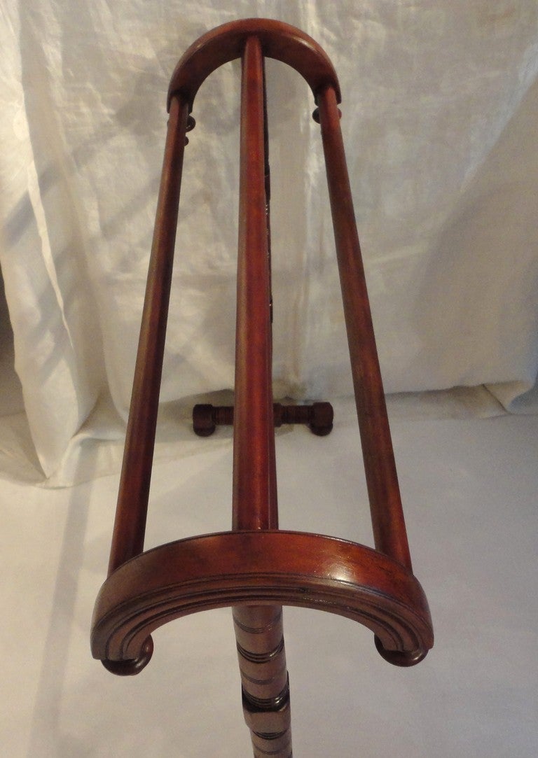 This amazing rounded ends 19thc  quilt rack has the most unusual form .This walnut rack could serve as a towel or blanket rack at the end of a bed.The condition is very good and sturdy.