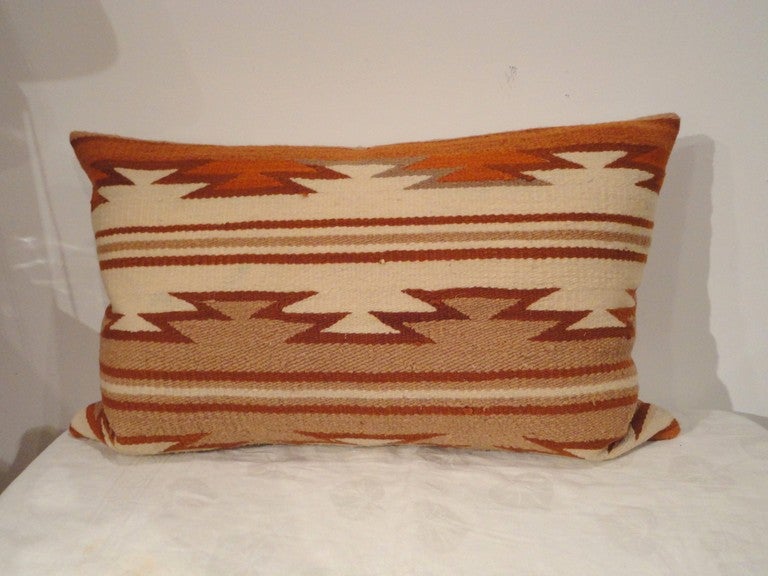 This pair of Indian weaving bolster pillows are wonderful colors and in crisp ,mint condition.This interesting geometric pattern is simple yet rich in color.Sold as a pair.