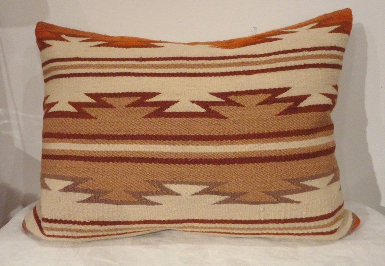 Fantastic Navajo weaving geometric bolster pillow with a tan cotton linen backing.This wonderful lg. scale simple pattern has warm yet cool colors.The insert is down & feather fill.The condition is crisp and mint.





