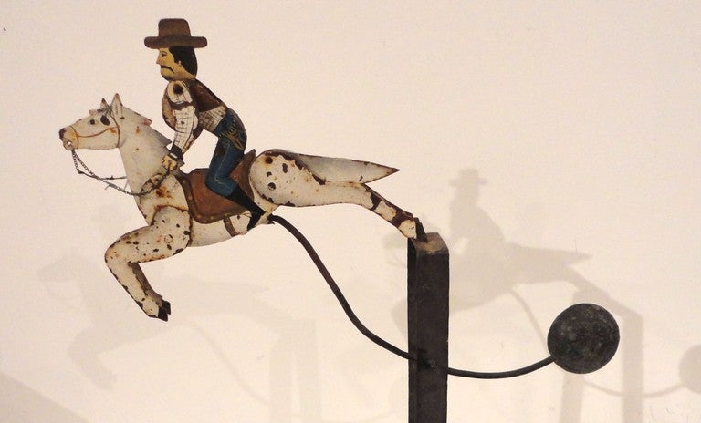 This early 1900's bucking bronco horse and rider was probably used at a early carnival .The wonderful surface is all original hand painted with a iron lead weight target.The base is also hand made and original painted with a custom made wood base to