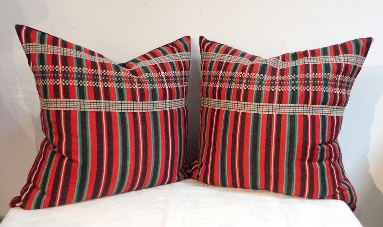 19th century red, green and black wool striped pillows.