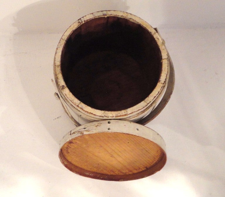 Fantastic white painted firkin bucket from New England. The condition is very good with construction.