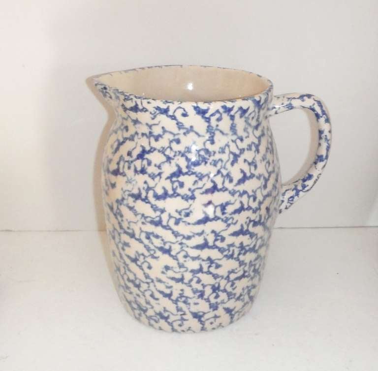 Large 19thc Sponge ware handled pitcher .This wide mouth pitcher  is great on a shelf or for flowers on a table .It is most unusual the size and the thick glaze pottery form .The condition is very good .