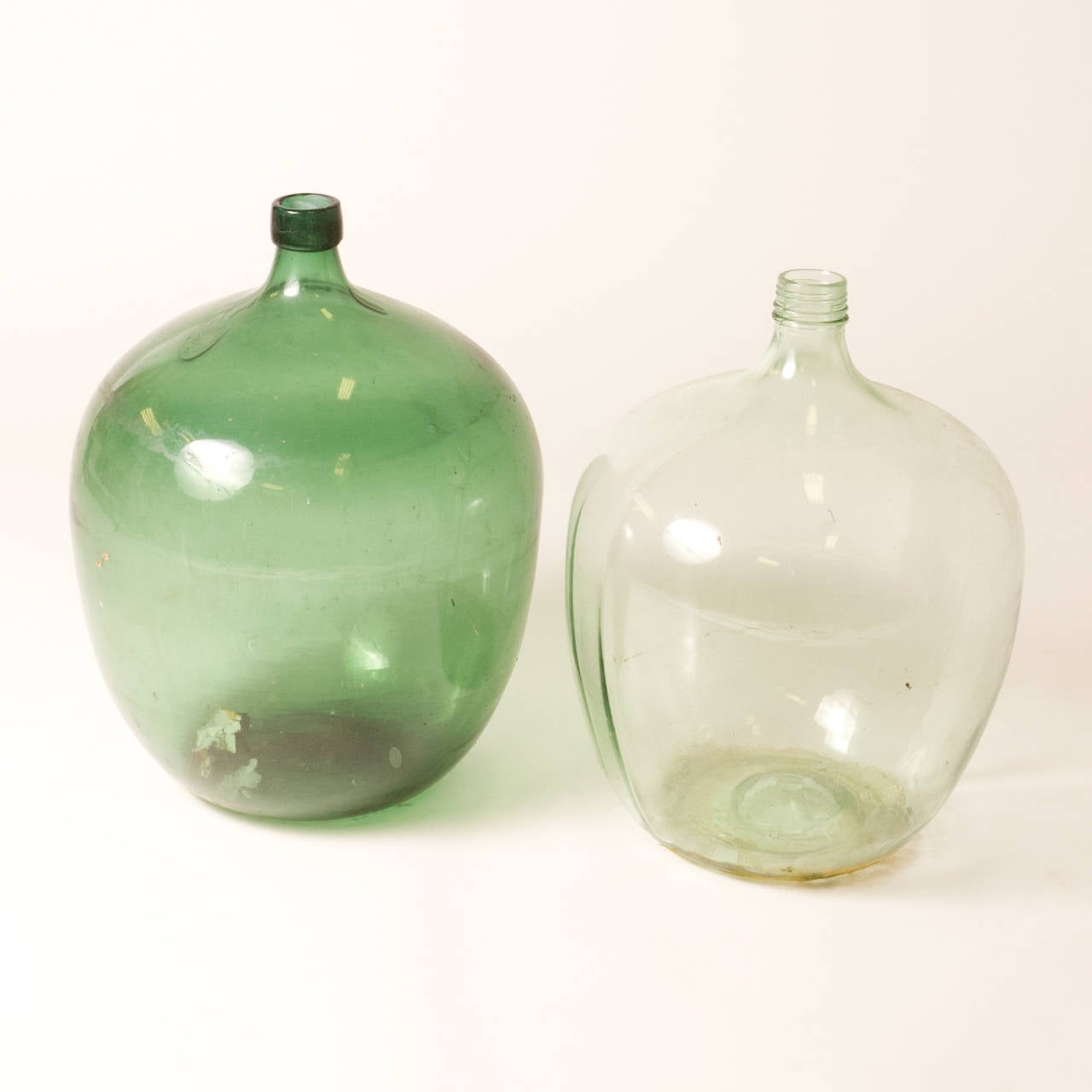 Industrial 1900 French Metal Baskets with Bottles in Clear and Green Glass