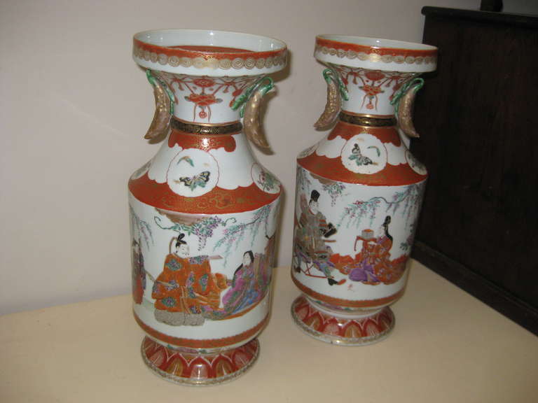 very fine pair of Japanese porcelain vases with excellent detail and unusual pod decoration on necks.  They are signed see image 10.