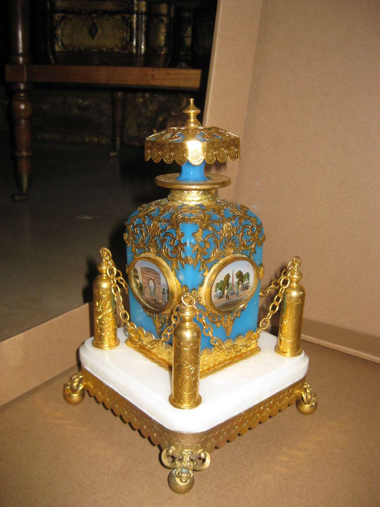 Rare fine blue opaline and gilt brassl mounted perfume on marble base. Grand tour monuments in miniature on each side of the bottle.