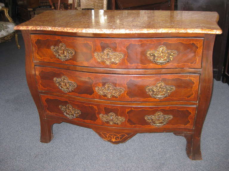 Beautiful 18th century marble top commode with ornate ormolu and inlay.