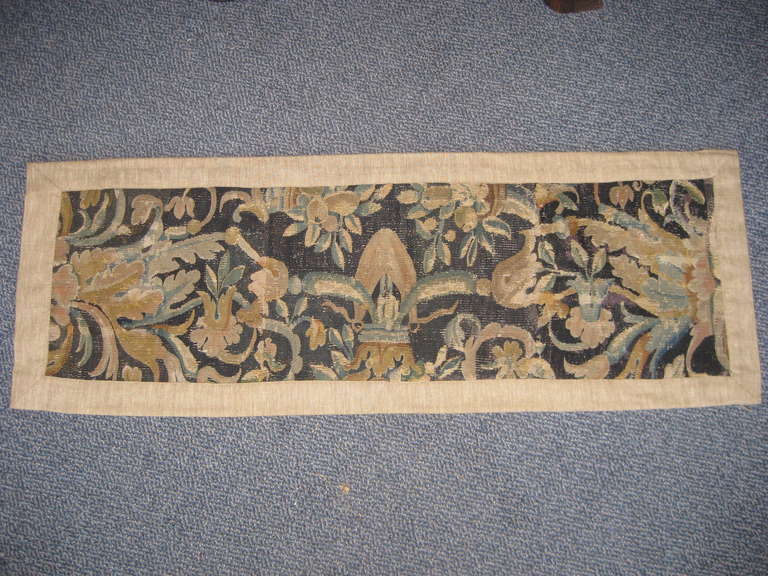 Pretty relined and backed 17th century Flemish tapestry fragment great for making a pillow or hanging on a wall.
