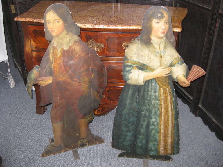 Charming pair of 19th century or earlier dummy boards  each with an area for weights in the back and a iron bar.