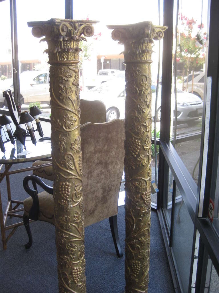 Wood Pair of Crusty Giltwood Columns with Grape Design For Sale