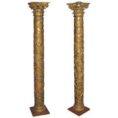 Pair of Crusty Giltwood Columns with Grape Design