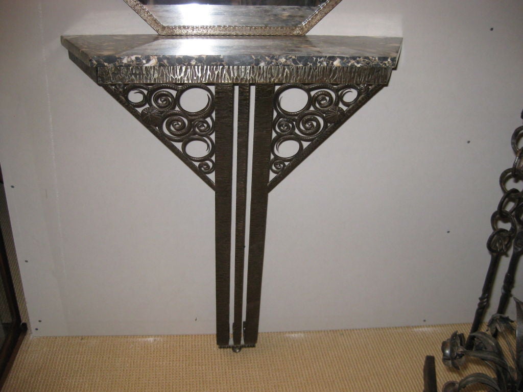 Beautiful art deco console with marble top and hanging mirror<br />
The mirror is 33