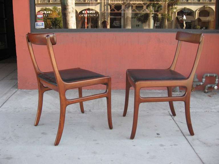 Set of six Ole Wanscher Mid-Century Modern Danish dining chairs in mahogany. Brand mark plates indicate the designer (see attached). 
Original upholstery is worn. Wood has been lightly restored. Chairs are in excellent functional antique condition.