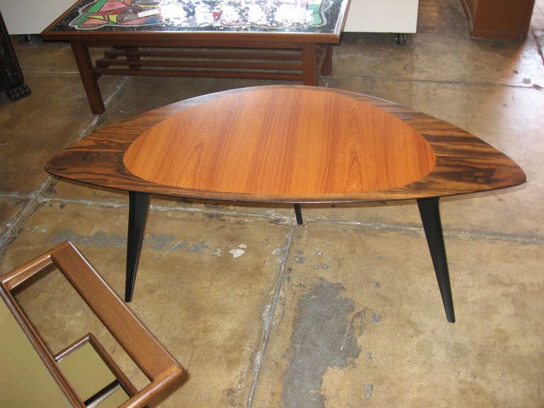 Swedish mid-century modern side/coffee table in elm and zebrano in a soft rectangular shape. Underside and three legs in ebonized birch wood.