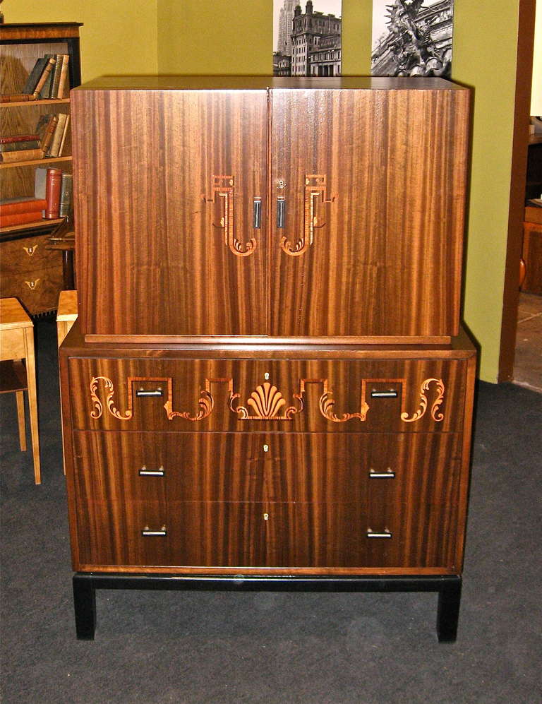 Swedish art deco era inlaid secretaire/chest of drawers in walnut, rosewood, ebony and birch woods. Interior in golden flame birch and walnut. Original metal and bakelite pulls. The perfect, compact work/storage solution. Made at Svenska